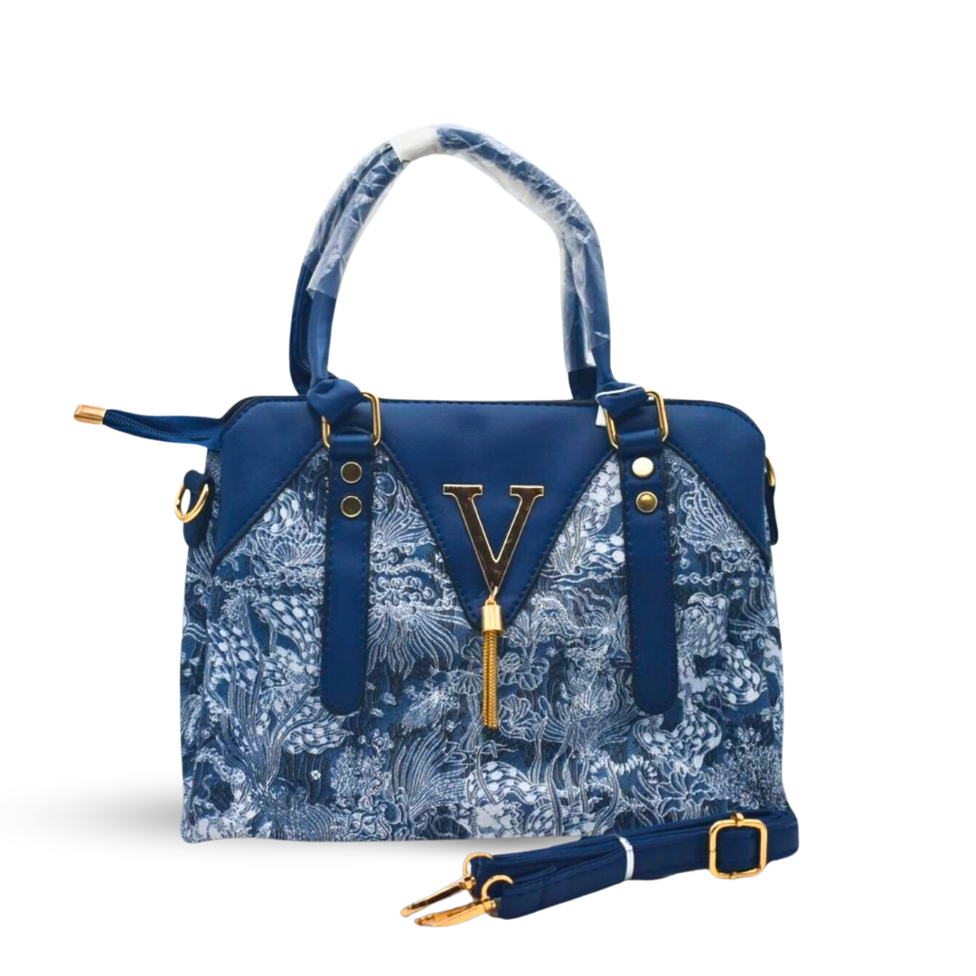 Timeless Leather Handbag with Elegant Fabric-Inspired Embroidery