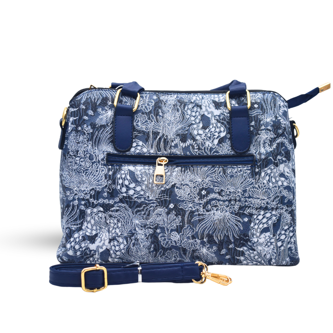 Timeless Leather Handbag with Elegant Fabric-Inspired Embroidery