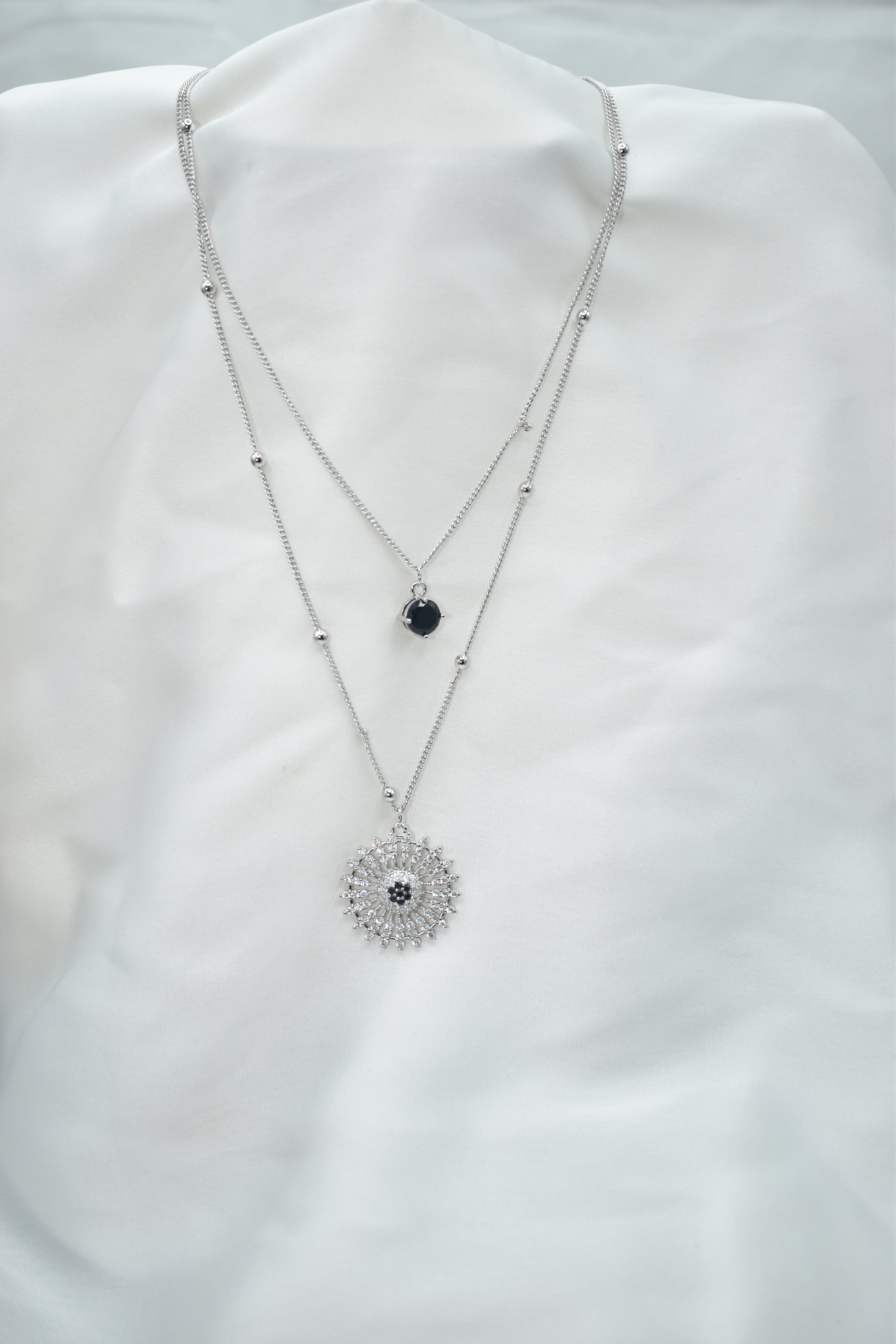 Stylish Double-Layer Necklace with Black Stone and Sunburst Pendant